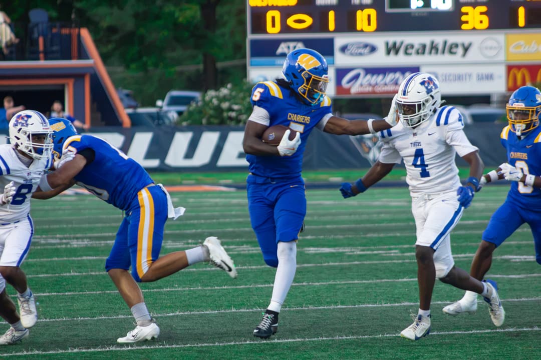 Westview senior running back Asa Barnes stiff arms a defender in the Chargers’ 54-6 win over Marshall County