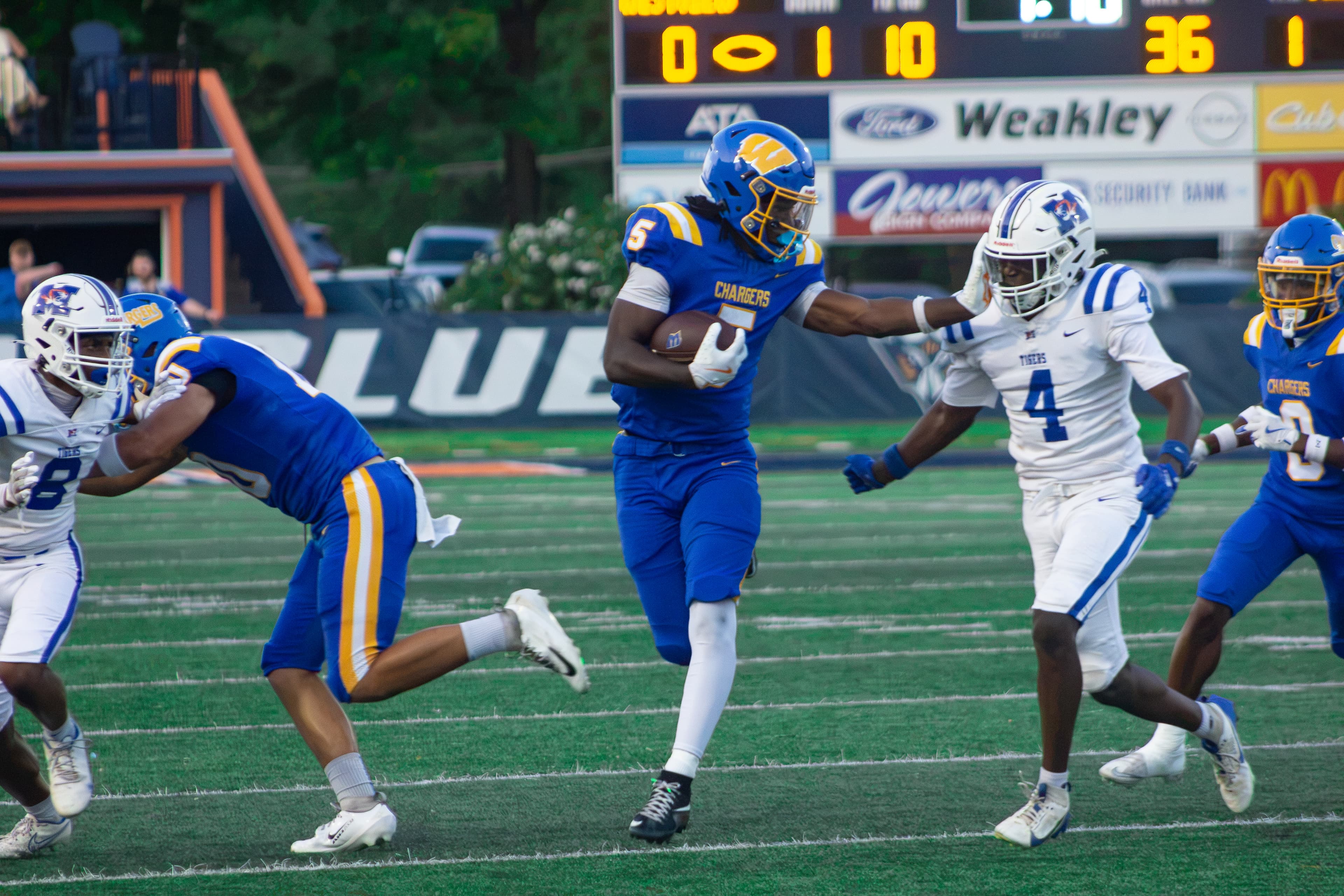 Westview senior running back Asa Barnes stiff arms a defender in the Chargers’ 54-6 win over Marshall County